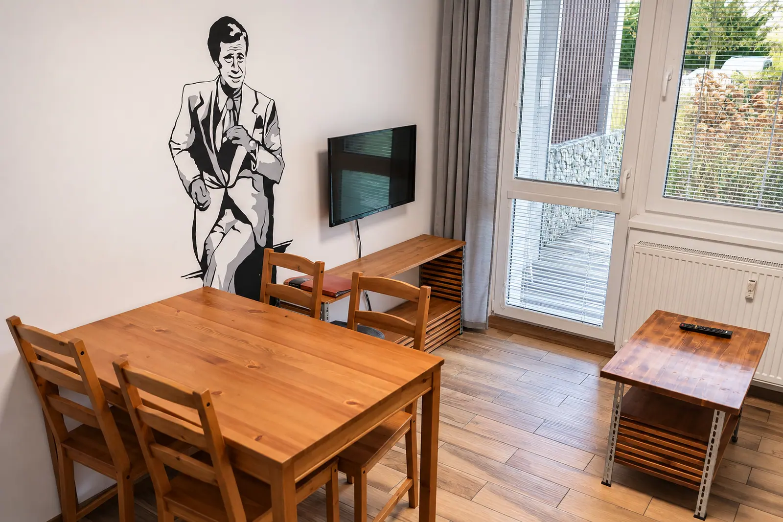 The apartment living room, with a dining table