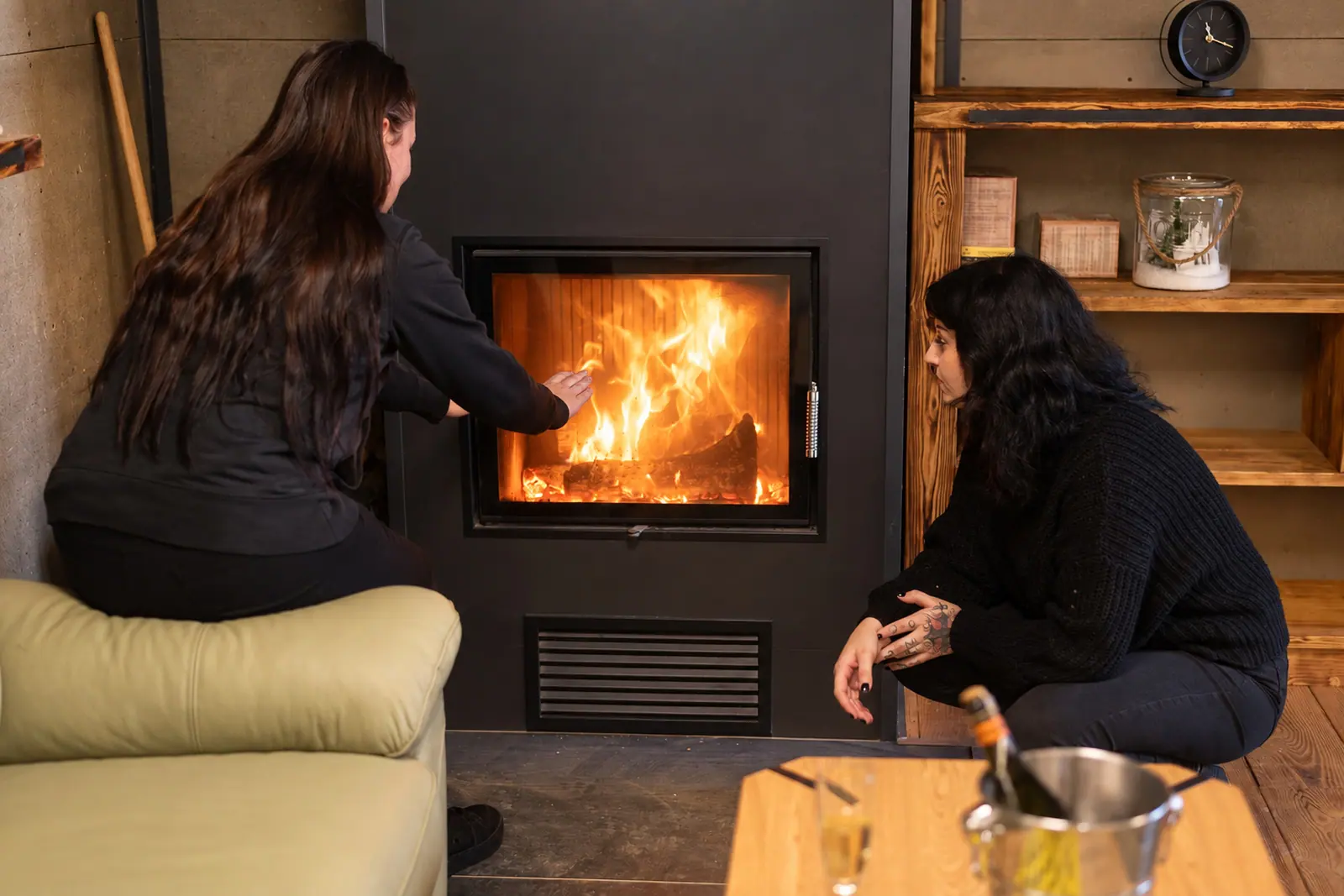 Guests by the clubhouse fireplace in the evening