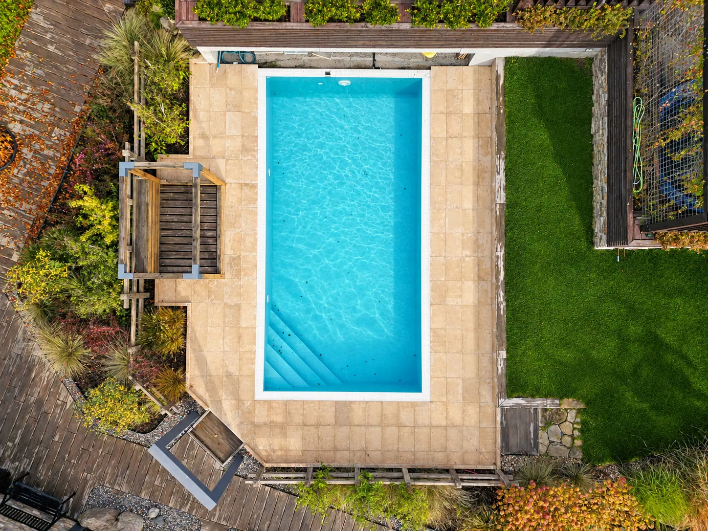 The pool, lawn and terrace seen from above