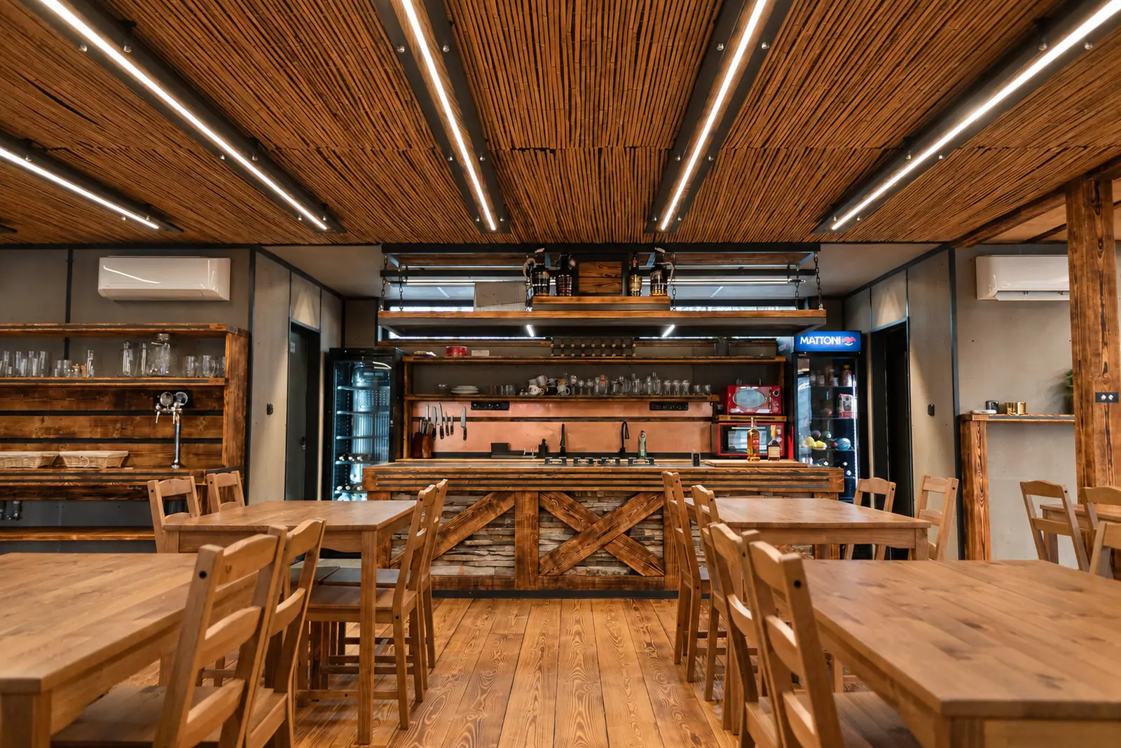 The clubhouse, with its timber ceiling and long tables