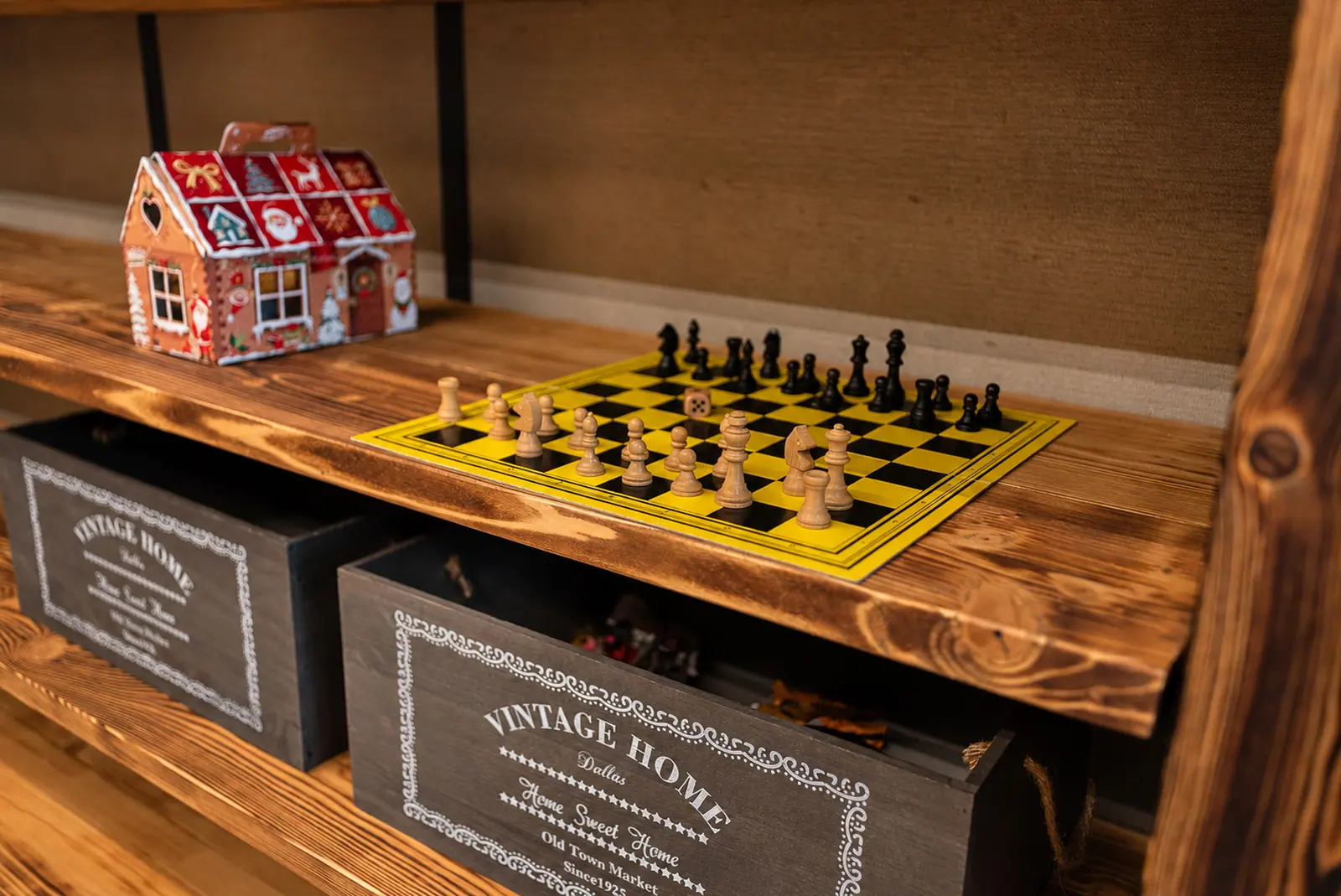 A chessboard and board games on the timber table