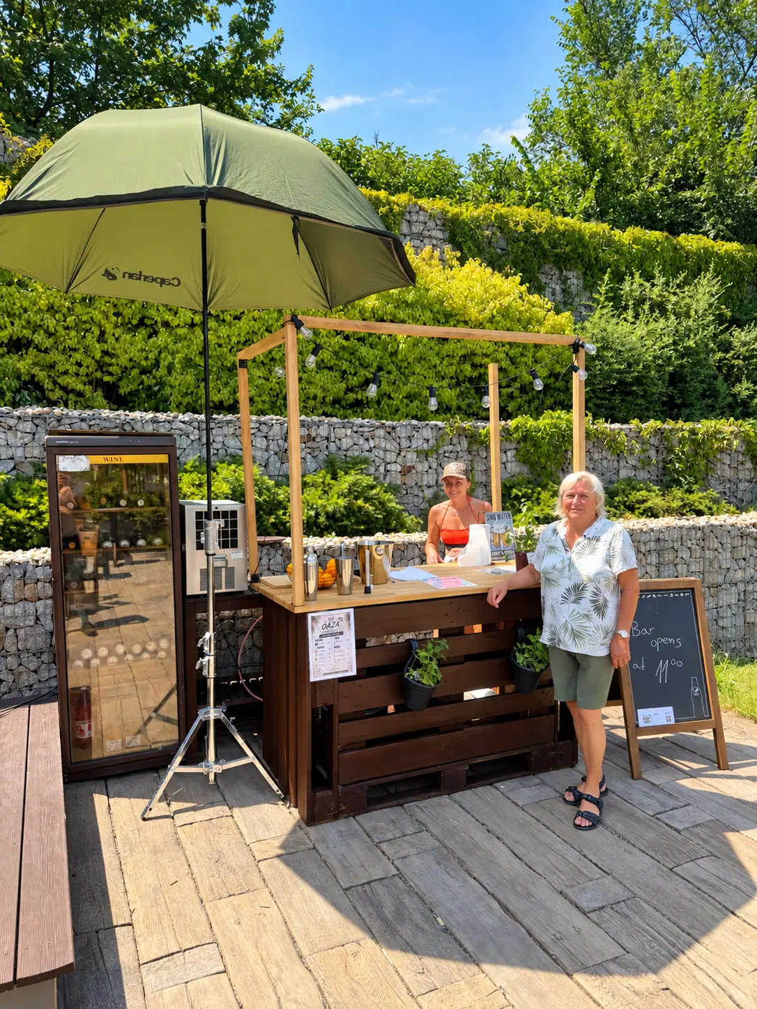 The timber garden bar under its parasol