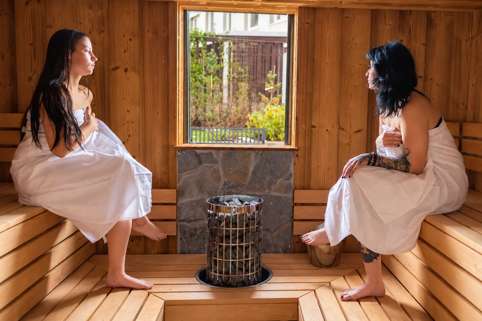 Guests in the sauna beside the stove